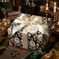 Luxury vintage floral wrapping paper with cream satin bow on a gift box by Wrapped Studios.
