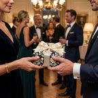 Couple exchanging gift in elegant navy floral wrapping paper with cream bow by Wrapped Studios.