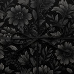 Elegant gift wrapped in black floral wrapping paper with a satin ribbon bow.
