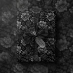 Elegant monochrome floral wrapping paper with sheer ribbon and bow.