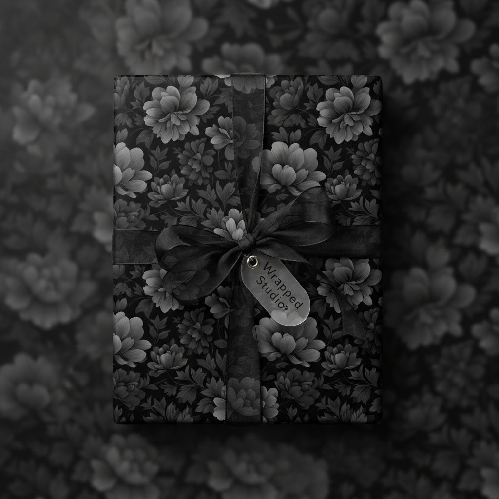 Elegant monochrome floral wrapping paper with sheer ribbon and bow.