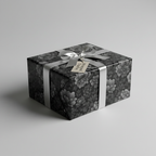 Elegant gift wrapped in black floral wrapping paper with a silver ribbon and bow.