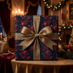 Luxury Christmas wrapping paper with a vintage burgundy floral print and gold ribbon, by Wrapped Studios.