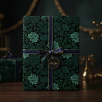 Elegant gift wrapped in dark floral wrapping paper with navy ribbon and "For You" tag.
