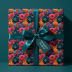 Luxury floral wrapping paper with teal, pink, and orange flowers and a satin bow, by Wrapped Studios.