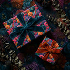 Luxury dark floral gift wrap with teal and orange velvet ribbons on gift boxes by Wrapped Studios.