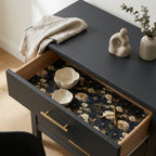 Dark floral wrapping paper used as a dresser drawer liner. Luxury gift wrap by Wrapped Studios.