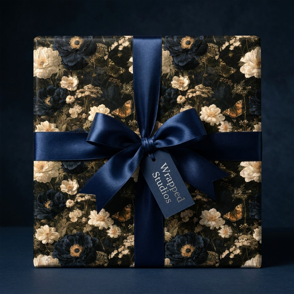 Luxury dark floral wrapping paper with navy blue satin bow, by Wrapped Studios.
