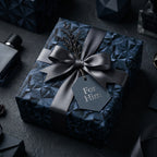 Navy geometric wrapping paper for him with grey satin ribbon and 'For Him' tag by Wrapped Studios.