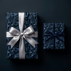 Luxury navy geometric wrapping paper with silver satin and blue velvet bows by Wrapped Studios.