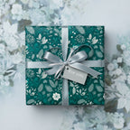 Teal floral wrapping paper with silver ribbon and "For you" tag, suitable for elegant Christmas or birthday gifts.