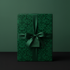 Elegant, forest green gift box wrapped in floral wrapping paper with a matching satin ribbon bow.