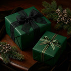 Elegant green gift wrapping paper with black lace and gold ribbon for Christmas or birthday presents.