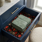 Luxury vintage floral wrapping paper used as drawer liner in a blue dresser by Wrapped Studios.