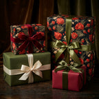 Luxury botanical Christmas gift wrap with vintage red floral patterns by Wrapped Studios.