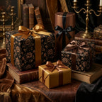 Luxury black and gold floral wrapping paper on elegant gift boxes with satin ribbons by Wrapped Studios.