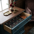 Moody dark floral wrapping paper used as a luxury drawer liner, by Wrapped Studios.
