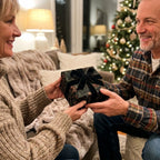 Couple exchanging a gift in luxury Christmas wrapping paper by Wrapped Studios.