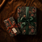 Luxury Christmas wrapping paper with pinecone pattern, satin bow, and velvet ribbon by Wrapped Studios.