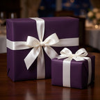 Elegant dark purple wrapping paper with white satin ribbon for luxury gift wrapping.
