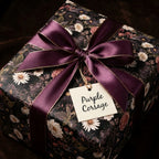 Luxury vintage floral wrapping paper with a purple bow and 'Purple Corsage' tag by Wrapped Studios.