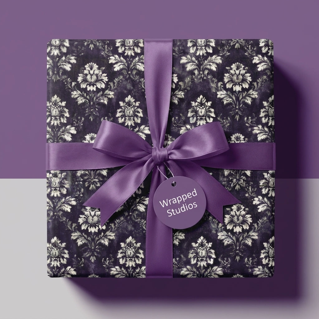 Luxury purple vintage damask wrapping paper with a satin bow by Wrapped Studios.