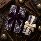 Luxury dark purple floral wrapping paper on gifts with velvet and satin bows by Wrapped Studios.