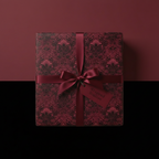 Elegant gift with luxury wrapping paper, damask floral pattern, burgundy ribbon.