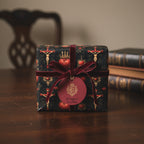 Elegant gift wrapped in religious themed luxury wrapping paper with velvet ribbon and tag.