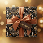 Square gift wrapped in black and gold Christmas wrapping paper with a copper ribbon and "Joyful Gifting" tag.