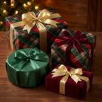 Luxury Christmas wrapping paper in green tartan plaid with gold and velvet bows by Wrapped Studios.