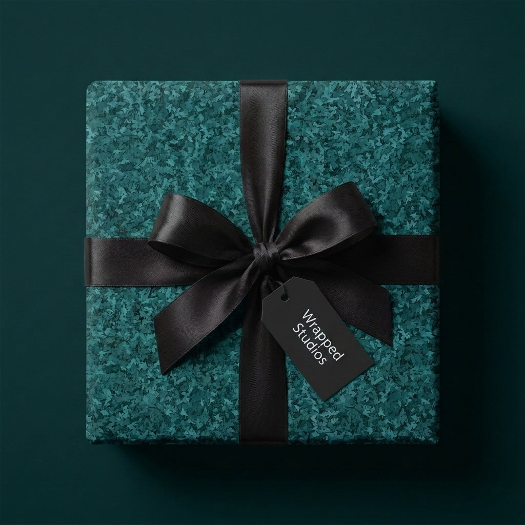 Luxury teal textured wrapping paper with a black satin bow on a gift box, by Wrapped Studios.