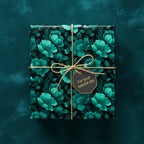 Square gift wrapped in teal floral wrapping paper with twine and "For your special day" tag.
