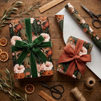 Luxury floral wrapping paper with green velvet and rust bows on gifts, by Wrapped Studios.