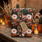 Desert floral wrapping paper with cactus print by Wrapped Studios on a gift with a Warm Wishes tag.