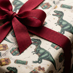 Wrapped gift in dinosaur birthday wrapping paper with red ribbon.