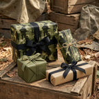 Army camouflage wrapping paper with soldier silhouettes on military gift boxes by Wrapped Studios.