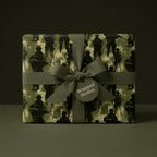 Military soldier wrapping paper with olive green ribbon, patriotic army gift wrap by Wrapped Studios.