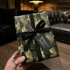 Camo soldier military wrapping paper with black ribbon and gift tag by Wrapped Studios.