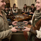 Medieval themed gift exchange with scaly pattern wrapping paper and brown twine.