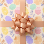 Pastel Easter wrapping paper with an egg pattern, peach bow, and ribbon.