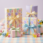 Pastel Easter wrapping paper featuring egg patterns and ribbon bows for springtime gifts.