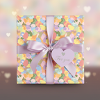Pastel wrapping paper with lilac ribbon and "For You" tag, perfect for birthday or baby shower gifts.