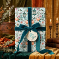 Elegant fall wrapping paper with a vintage pumpkin pattern and teal velvet ribbon by Wrapped Studios.