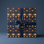 Luxury gift wrap featuring a beetle and floral design with a navy satin ribbon.