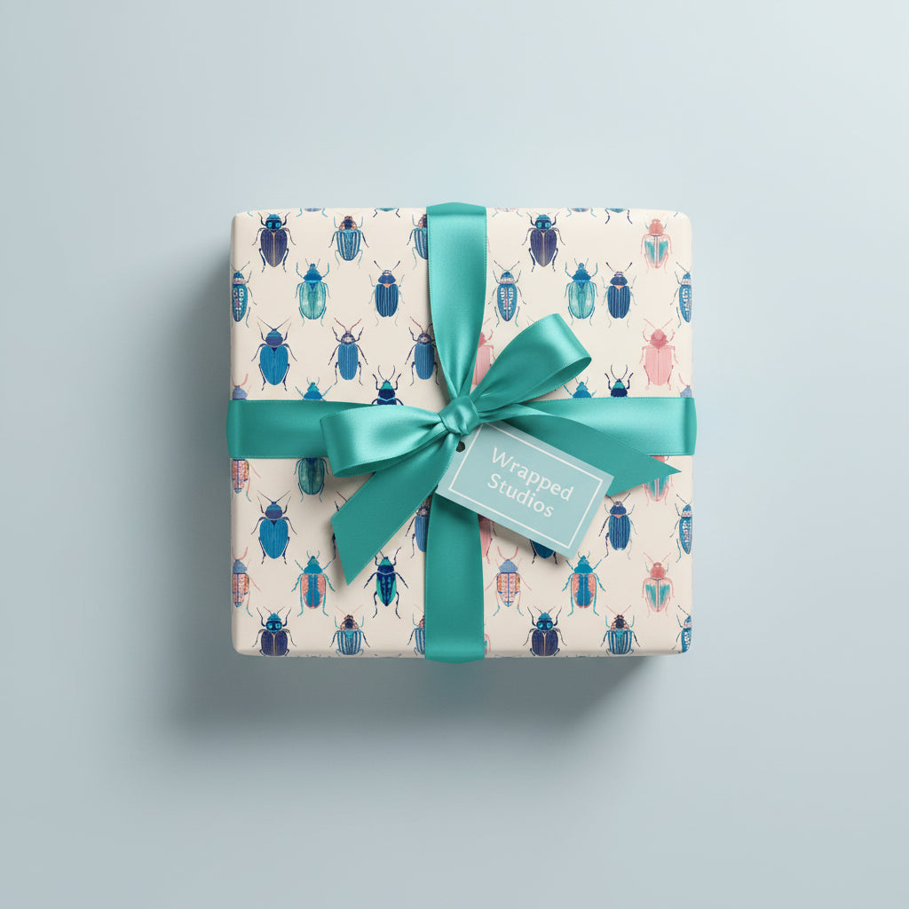 Square gift wrapped in beetle print paper with a teal ribbon, perfect for birthdays or unique occasions.