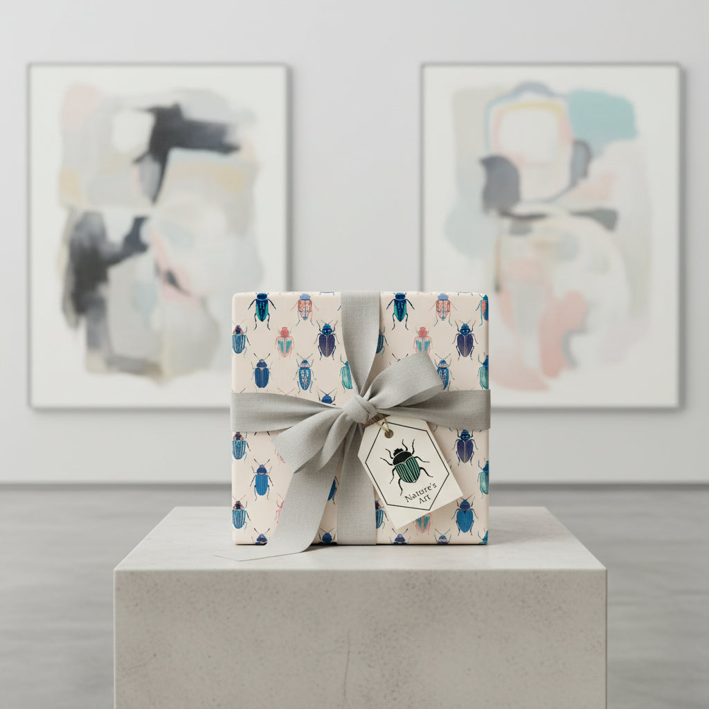 Gift wrapped in bug-themed wrapping paper with a gray ribbon and "Nature's Art" tag.