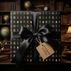 Sophisticated beetle wrapping paper with a black satin ribbon against a backdrop of antique books and globes.