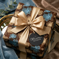 Brown floral wrapping paper with a gold satin ribbon from Wrapped Studios.