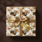 Luxury floral wrapping paper with gold ginkgo leaves and a satin bow by Wrapped Studios.